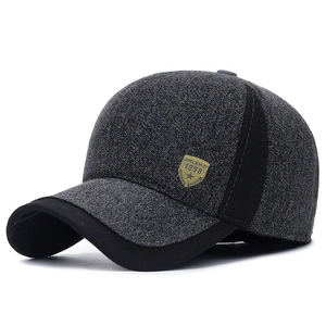 Winter men's baseball cap in dark grey wool blend with warm ear flaps and metal emblem