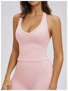 Detail of pink yoga set showing high-elastic knitted fabric and seamless stitching