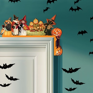 Close-up of Halloween wooden door corner decoration with pumpkin and witch on white frame