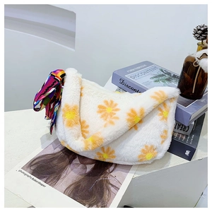 Detail of white faux fur tote with daisy print and decorative geometric silk scarf handle