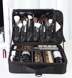 Detail of adjustable dividers and brush slots in a large oxford makeup organizer bag