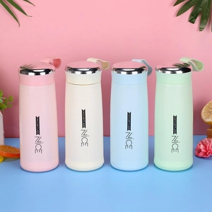 Detail of four colorful vacuum flasks in pink beige blue green with silicone straps