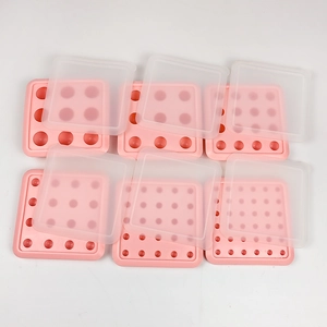 Set of 6 pink silicone ice ball molds with 9 round cavities and translucent lids
