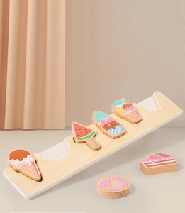 Detail of wooden dessert blocks and macaron-colored toy base for toddler early learning