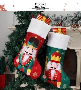 Detailed view of red and green Nutcracker Christmas stockings with plush fur and white beard