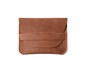 Detail view of brown crazy horse leather card holder with secure strap and contrast stitching