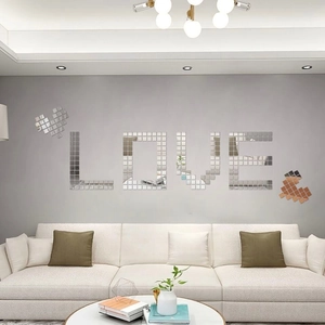 DIY self-adhesive mirror wall decals with LOVE and heart shapes in a modern living room