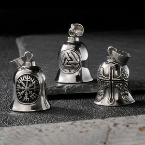 Detailed close-up of stainless steel Viking bells with engraved Valknut and cross symbols