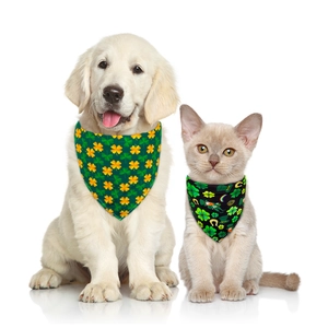 St. Patrick's Day pet bandana with green clover patterns on Golden Retriever and cat