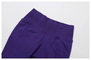 Detail of high-waist seamless yoga pants featuring a wide ribbed elastic waistband