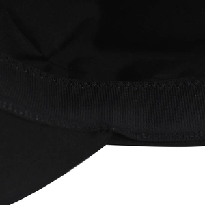Macro detail of stitching and sweatband texture on a black cotton military baker boy hat