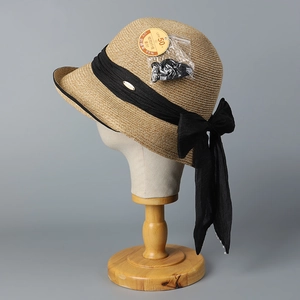 Japanese straw sun hat with wide brim, black ribbon bow and UPF 50 plus protection