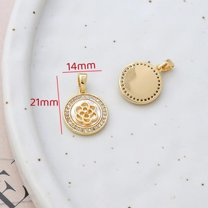 Detail of 14mm 14k gold-filled round pendant with shell inlay and cubic zirconia