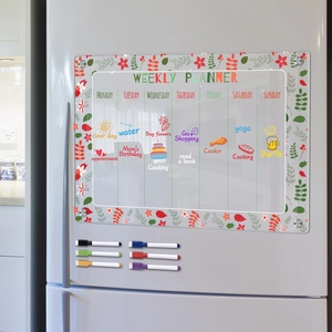 Magnetic acrylic weekly planner with floral border and six colored markers on fridge