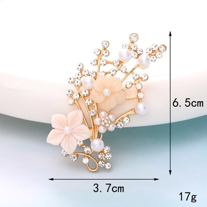 Detail view of pink flower brooch with pearls and rhinestones showing 6.5cm height