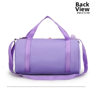 Back view of a purple cylindrical ballet dance bag for girls with adjustable strap