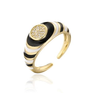 Detail of 18K gold ring with zebra enamel stripes and micro-set cubic zirconia