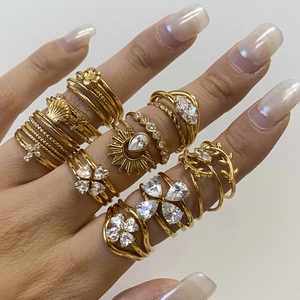 Set of gold-plated stainless steel geometric rings with sparkling clear zircons