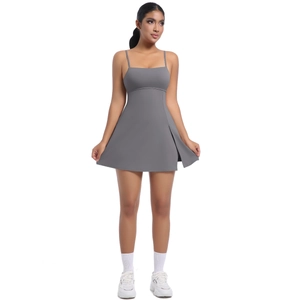 Detail view of dark grey sports dress featuring a side slit and sleek athletic straps