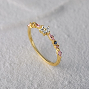 Close-up of S925 silver flower ring with pink marquise gems and white diamonds