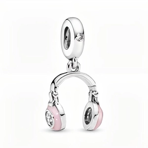 Detailed view of silver-plated headphone charm with pink enamel and sparkling rhinestones