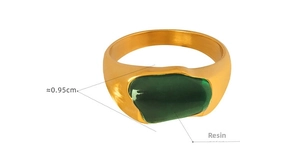 Detail shot of golden wide band ring with a 0.95cm green irregular resin stone inlay