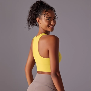 Detail of racerback sports bra and high-waist leggings showing seamless texture and fit