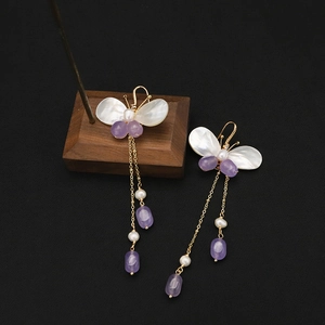 Elegant butterfly long tassel earrings with natural pearls and purple beads in gold finish