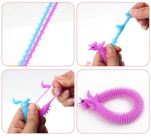 Blue and purple stretchy unicorn stress toys made of soft TPR material in various states