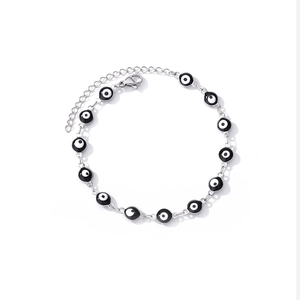 Detail of silver chain bracelet with evil eye beads and adjustable lobster clasp