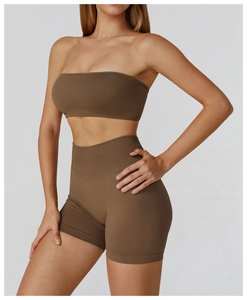 Detail of seamless brown sports bra and high-waisted shorts with ribbed texture
