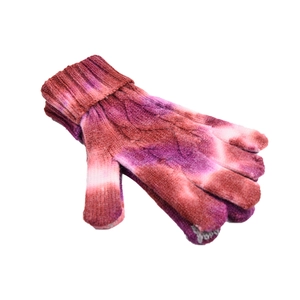 Detail of colorful tie-dye knitted gloves with warm cable knit pattern and ribbed cuffs