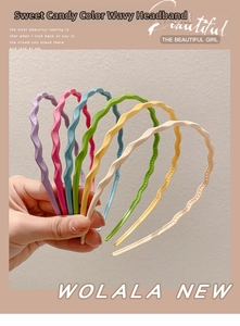 Detail showing wavy candy-colored headbands with non-slip teeth for secure styling