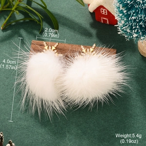 Detail view of snowflake earrings with white fur balls and rhinestones including dimensions