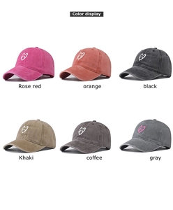 Detailed color display of vintage washed cotton baseball caps with EXO heart embroidery