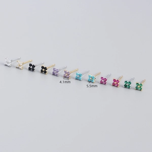 Macro shot of colorful S925 sterling silver four-leaf flower studs with size dimensions