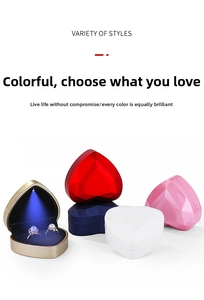 Macro detail of heart-shaped LED jewelry boxes in multiple colors with velvet lining