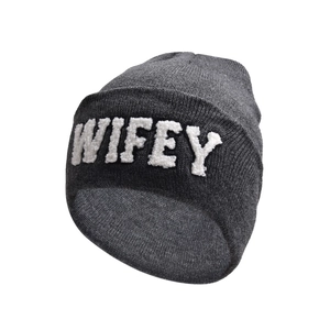 Close-up of deep grey knitted beanie featuring white plush WIFEY letter embroidery