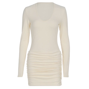 Detailed view of cream ruched mini dress with deep U-neckline and elastic pleated texture
