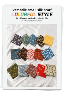 Flat lay of colorful assorted cotton-linen scarves with floral and geometric patterns