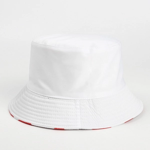 Detail of classic white bucket hat showing reinforced brim stitching and red plaid lining