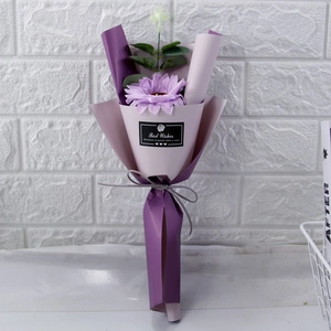 Detail of single purple soap flower bouquet with eucalyptus and Best Wishes ribbon