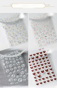Macro detail of 3D minimalist heart nail stickers with various artistic relief designs