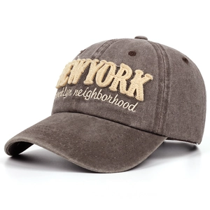 Close-up of vintage washed cotton baseball cap with 3D New York embroidery and fine stitching