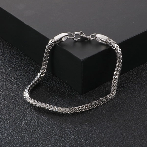 Detail of silver stainless steel keel chain bracelet with V-shaped weave and lobster clasp
