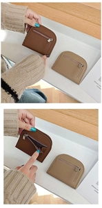 Detail showing litchi grain texture and metal zipper on semi-round mini coin purses