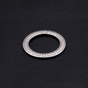 Polished titanium steel ring featuring classic Greek meander pattern engraving