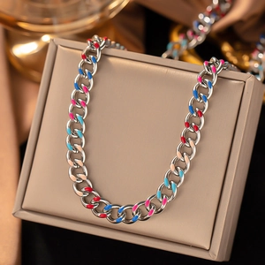 Macro shot of silver titanium steel chain necklace with colorful drip oil enamel accents