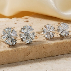 Elegant silver copper stud earrings with sparkling cubic zirconia flower design on stone