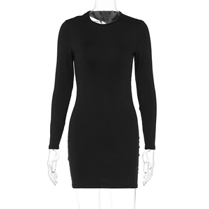 Detailed view of black bodycon mini dress featuring round neck and long sleeves on mannequin